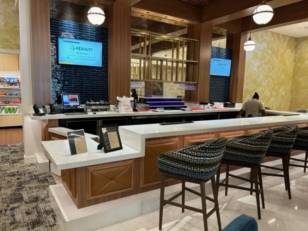 bar area with high chairs and television st james square superior millworks