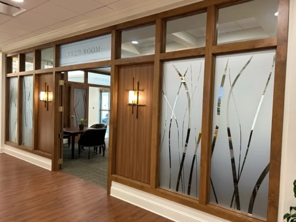 club room with decorative frosted glass walls st james square superior millworks