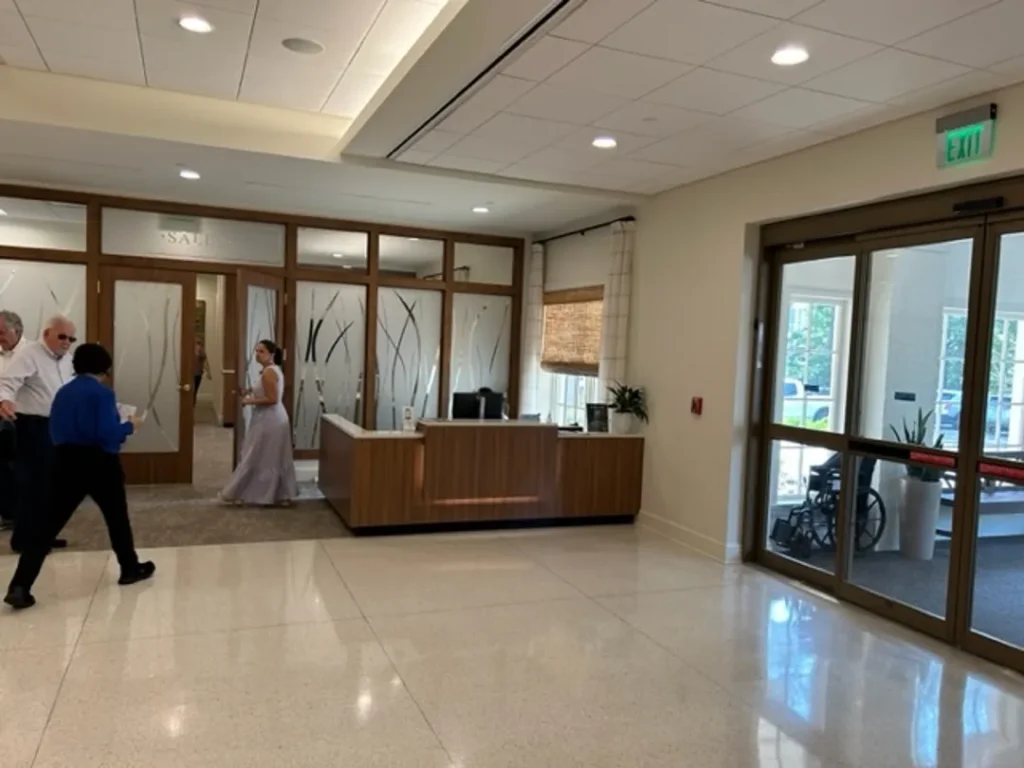 reception area with glass doors and natural light st james square superior millworks